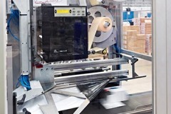 The label printer inside the bagging machine at Unipart Technology Logistics